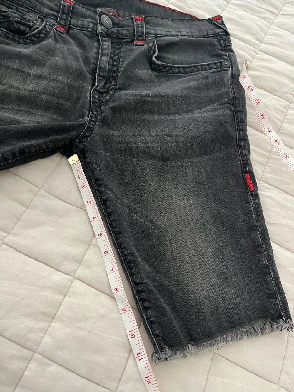 True Religion Men’s Black Denim Cutoff Shorts with flaw